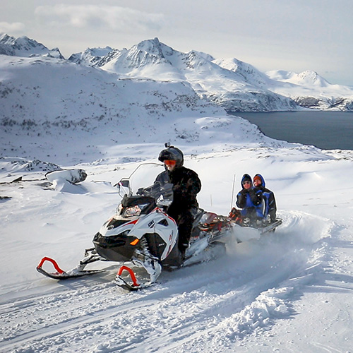 Daytime snowmobiling at Arctic Panorama Lodge